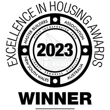 Black and white Winner badge for the 2023 Excellence in Housing Awards by the Master Builders Association of New South Wales, Australia, featuring a circular seal and architectural outline.