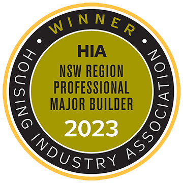 A round gold and black badge that reads: Winner HIA NSW Region Professional Major Builder 2023 with Housing Industry Association written around the border.