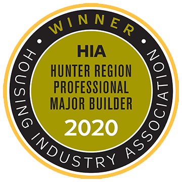 A gold and black circular badge reading WINNER HIA HUNTER REGION PROFESSIONAL MAJOR BUILDER 2020 and HOUSING INDUSTRY ASSOCIATION around the edge.